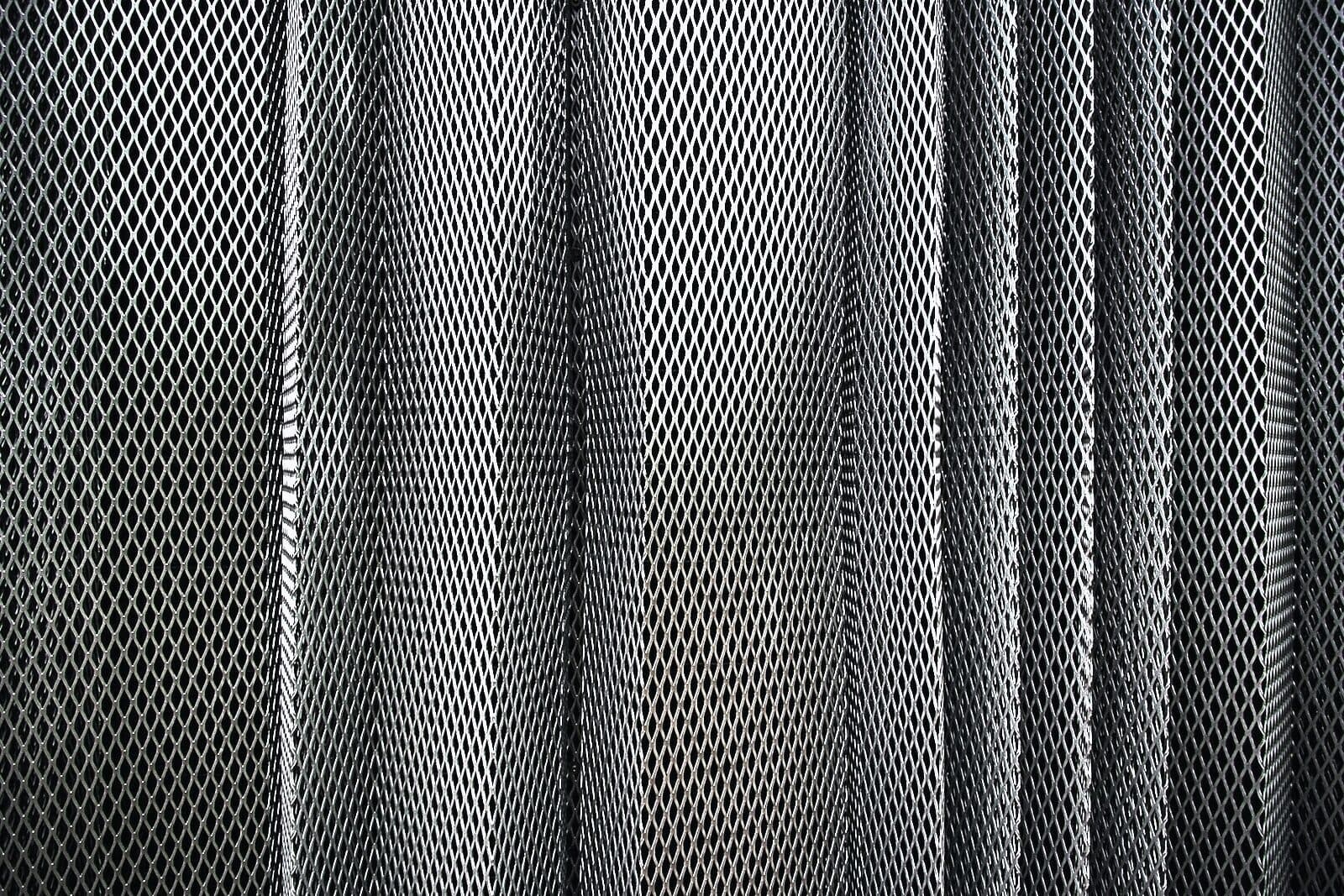 Close detail of dark expanded-metal security mesh